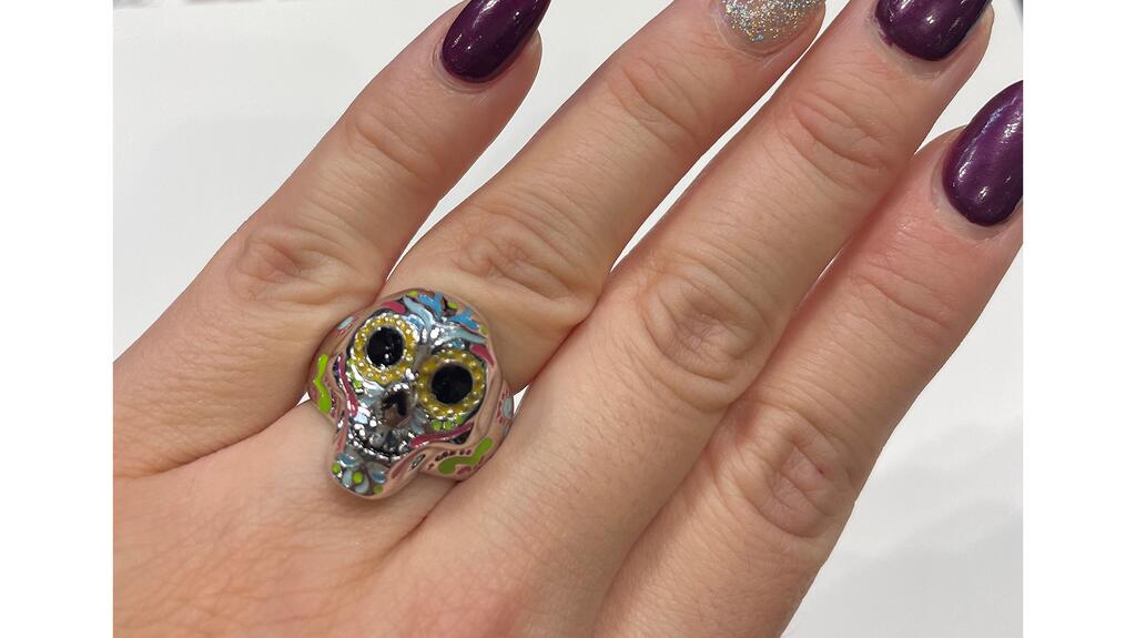 A silver and enamel sugar skull ring ($150) 20221014_4-Comic Con.jpg